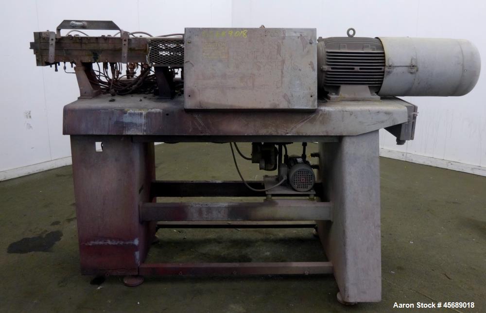 Used APV Baker Perkins 30mm Twin Screw Compounder Extruder, Model MP30. Approximate 15 to 1 L/D ratio. Co-rotating screw design. Clamshell design, 3 zone electrically heated, liquid cooled barrel. Wa...