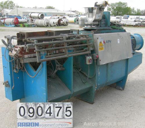 Used: APV twin screw extruder, 50mm screw diameter, model MPF50. Approximately 25:1 L/D ratio. Co-rotating screw design. 4 zone top vented electrically heated, water cooled split design barrel. (1) f...