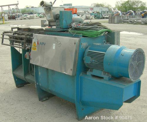 Used: APV twin screw extruder, 50mm screw diameter, model MPF50. Approximately 25:1 L/D ratio. Co-rotating screw design. 4 zone top vented electrically heated, water cooled split design barrel. (1) f...
