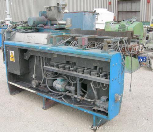 Used: APV twin screw extruder, 50mm screw diameter, model MPF50. Approximately 25:1 L/D ratio. Co-rotating screw design. 4 zone top vented electrically heated, water cooled split design barrel. (1) f...