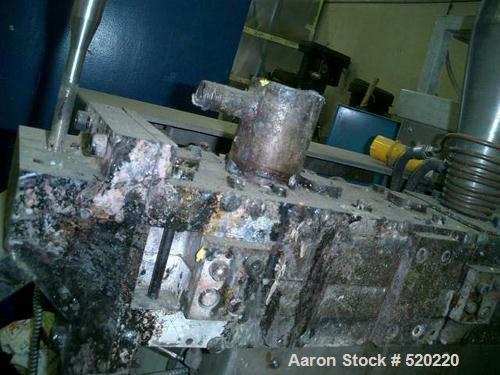 USED: APV lab size twin screw extruder, 30mm, 15:1 L/D. 1.17" diameterx 17.6" long (30mm diameter x 450mm long) screws. Screw speed 0-500 rpm via a gearbox by an 11.25 hp/7.5 kw main motor. Split bar...