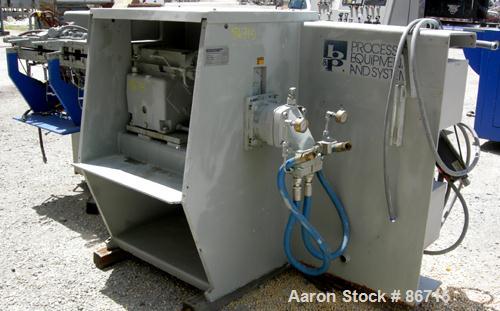 Used Baker Perkins Twin Screw Extruder, 50 MM Screw Diameter, Model MP2050. Approximate 25:1 L/D ratio. Co-rotating screw design. Clamshell design, 5 zone electrically heated, water cooled barrel sec...