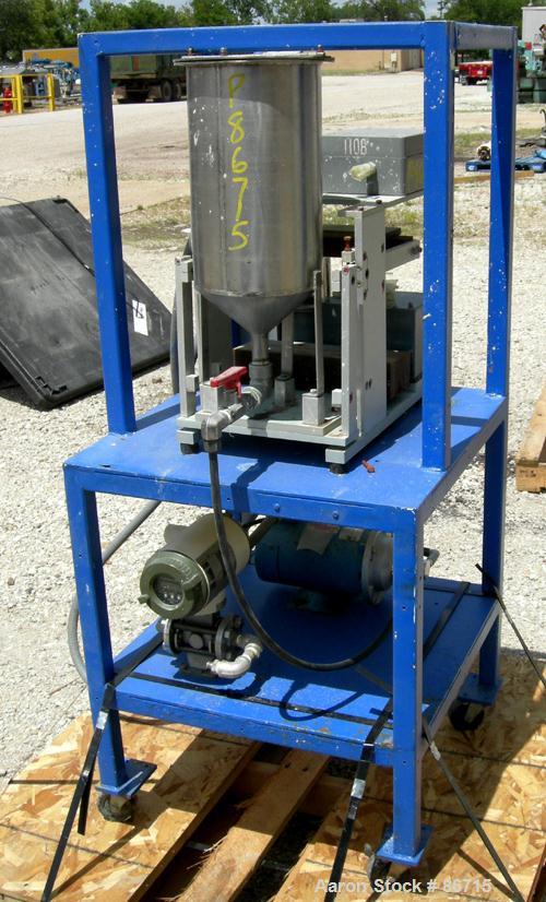 Used Baker Perkins Twin Screw Extruder, 50 MM Screw Diameter, Model MP2050. Approximate 25:1 L/D ratio. Co-rotating screw design. Clamshell design, 5 zone electrically heated, water cooled barrel sec...