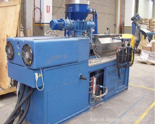 Used Bausano MD 52/53 Twin Screw Extruder. Screw diameter 2.04" (52mm). Maximum throughput 65 kg/hour. Main motor 49 hp, 36.4 kW, L/D ratio 23. Parallel screw configuration. Air cooling.