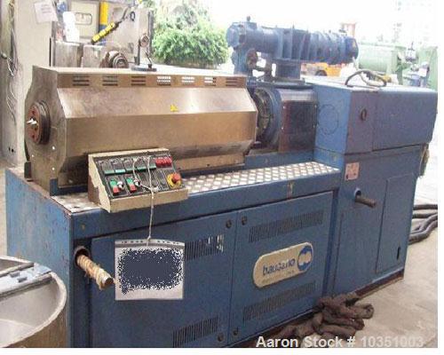 Used Bausano MD 52/53 Twin Screw Extruder. Screw diameter 2.04" (52mm). Maximum throughput 65 kg/hour. Main motor 49 hp, 36.4 kW, L/D ratio 23. Parallel screw configuration. Air cooling.