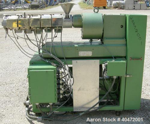 Used Berstorff 25mm Twin Screw Extruder, model ZE25. Co-rotating side by side screw design. Approximately 28 to 1 L/D ratio. 5 barrel sections, electrically heated, air cooled, 1 feed section. 46" ce...