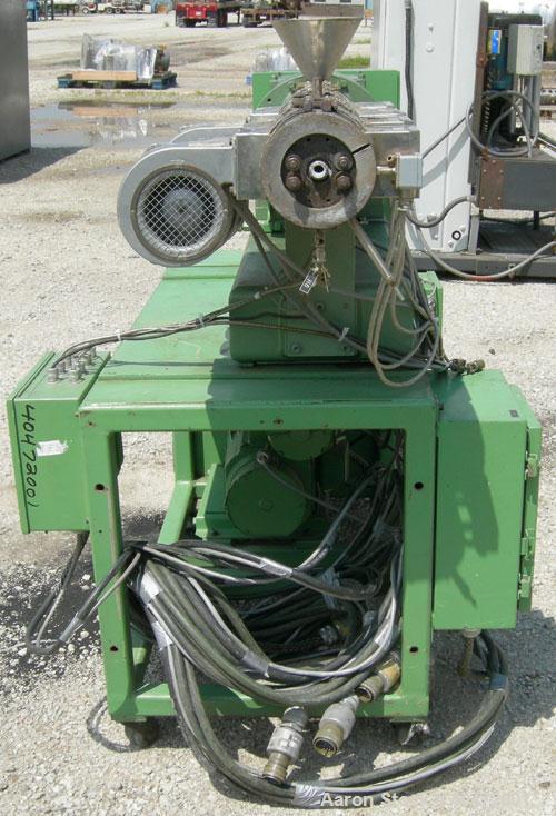 Used Berstorff 25mm Twin Screw Extruder, model ZE25. Co-rotating side by side screw design. Approximately 28 to 1 L/D ratio. 5 barrel sections, electrically heated, air cooled, 1 feed section. 46" ce...