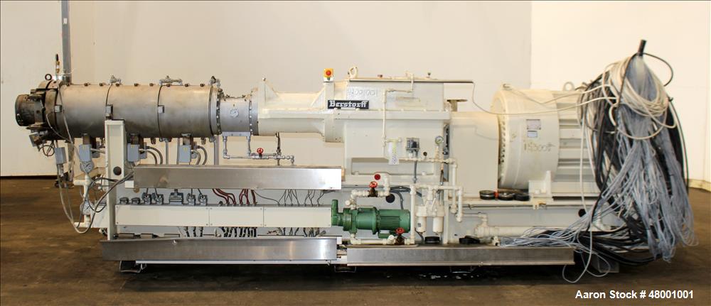 Used Berstorff 75mm Twin Screw Extruder, Model ZE75A. 4 barrel Zone electrically heated, water cooled system including pump and heat exchanger. Approximate 2.95" diameter  approx. 16:1 L/D Ratio,wate...