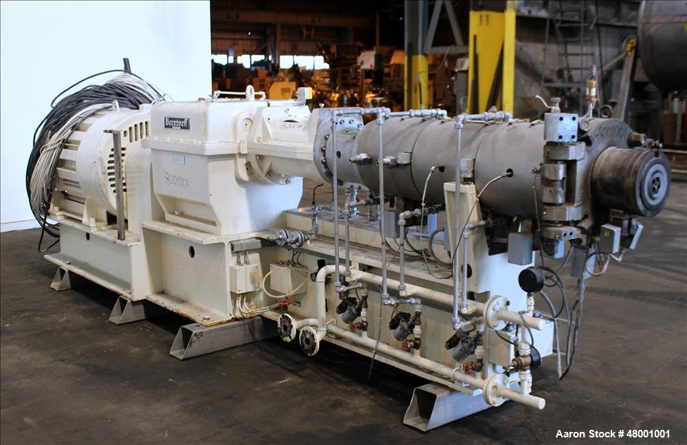 Used Berstorff 75mm Twin Screw Extruder, Model ZE75A. 4 barrel Zone electrically heated, water cooled system including pump and heat exchanger. Approximate 2.95" diameter  approx. 16:1 L/D Ratio,wate...