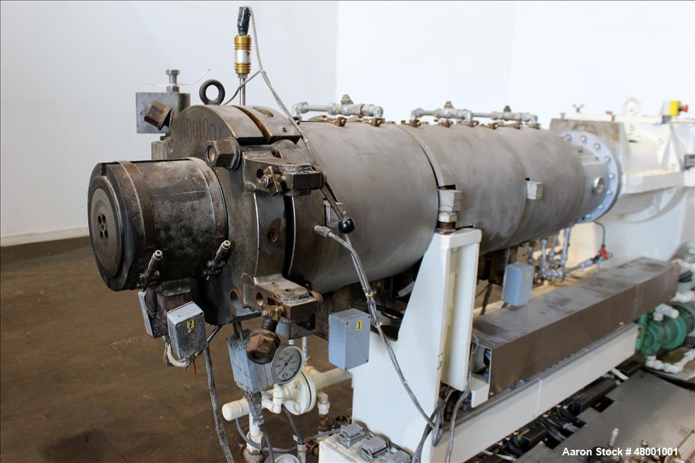 Used Berstorff 75mm Twin Screw Extruder, Model ZE75A. 4 barrel Zone electrically heated, water cooled system including pump and heat exchanger. Approximate 2.95" diameter  approx. 16:1 L/D Ratio,wate...