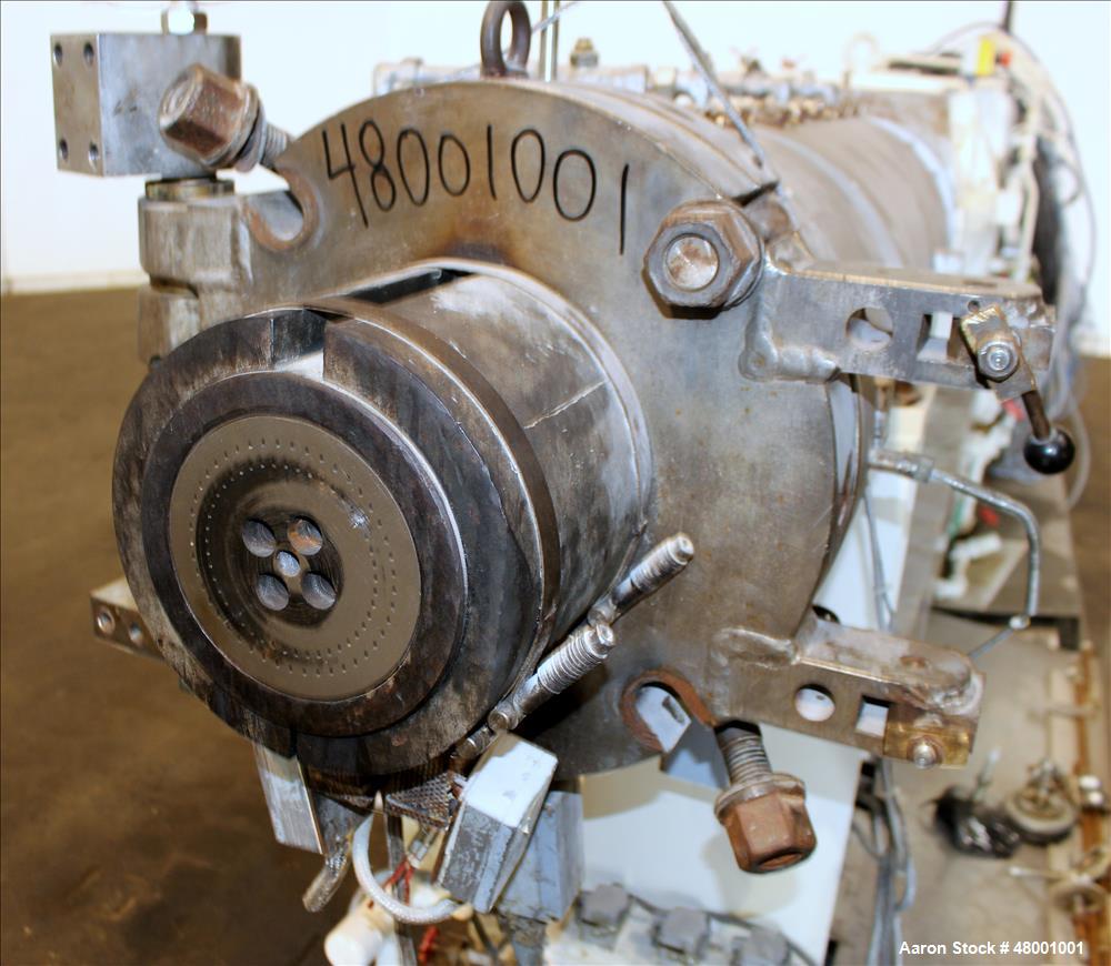 Used Berstorff 75mm Twin Screw Extruder, Model ZE75A. 4 barrel Zone electrically heated, water cooled system including pump and heat exchanger. Approximate 2.95" diameter  approx. 16:1 L/D Ratio,wate...