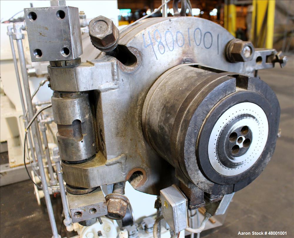 Used Berstorff 75mm Twin Screw Extruder, Model ZE75A. 4 barrel Zone electrically heated, water cooled system including pump and heat exchanger. Approximate 2.95" diameter  approx. 16:1 L/D Ratio,wate...