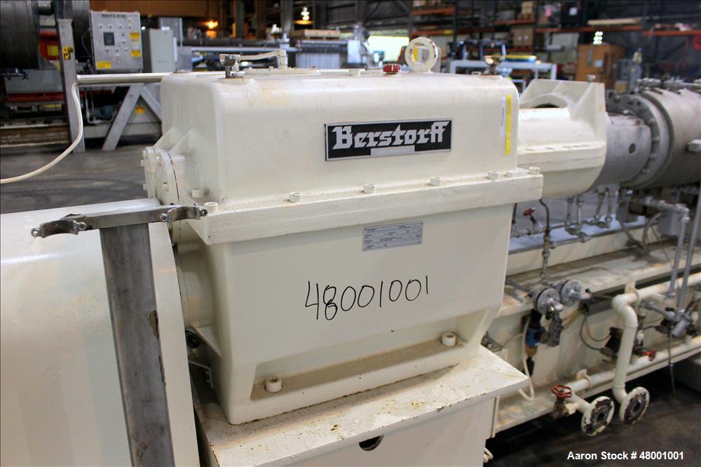 Used Berstorff 75mm Twin Screw Extruder, Model ZE75A. 4 barrel Zone electrically heated, water cooled system including pump and heat exchanger. Approximate 2.95" diameter  approx. 16:1 L/D Ratio,wate...