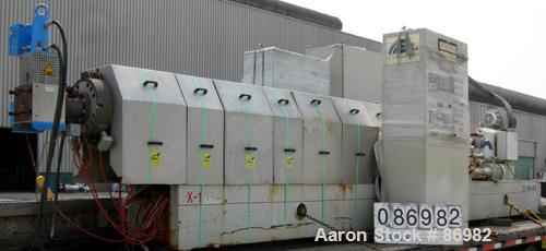 Used Berstorff Twin Screw Extruder, Model ZE90RX40D, 102 mm screw diameter. Approximate 40:1 L/D ratio. Co-rotating screw design. 7 zone electrically heated, water cooled barrel with pump, tank and h...