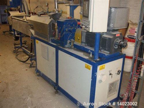 Used Comac EBC24-40D Twin Screw Co-Rotating Extruder. Screw diameter 1" (25 mm), ratio 40 D. Motor 32 hp/24 kW DC with max 1200 rpm screw speed. Vented with vacuum pump, water bath, pelletizer, volum...