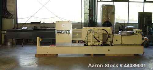 Used Coperion ZSK 70 Mc Twin Screw Extruder.  2.76" (70 mm) screws, screw speed 400 rpm.  Driven by a 153 hp/115 kW motor, 340/460/3/50, with a Flender gearbox.  Water cooled with (1) side opening.  ...