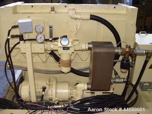 Used Coperion ZSK 70 Mc Twin Screw Extruder.  2.76" (70 mm) screws, screw speed 400 rpm.  Driven by a 153 hp/115 kW motor, 340/460/3/50, with a Flender gearbox.  Water cooled with (1) side opening.  ...