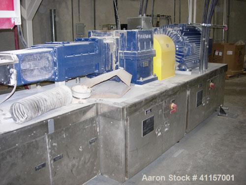 Used ENTEK MODEL EMAX 73MM EXTRUDER HAVING (2) CO-ROTATING INTERMESHING SCREWS. EXTRUDER BARREL CONSISTS OF TWELVE SECTIONS AND IS ELECTRICALLY HEATED AND WATER COOLED (CLOSED LOOP). GEAR BOX IS A HE...