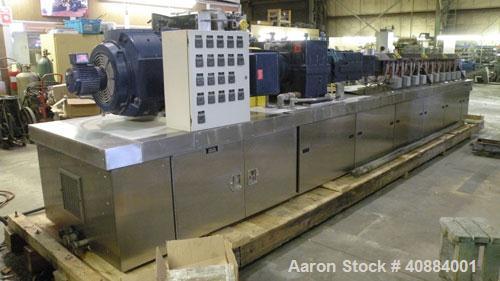 Used Entek 73 mm Co-Rotating Twin Screw Extruder, Model E-MAX 73MM 48L/D, 48 to 1 L/D ratio. (11) Barrel sections electrically heated, water cooled with system including pump, heat exchanger, and hol...