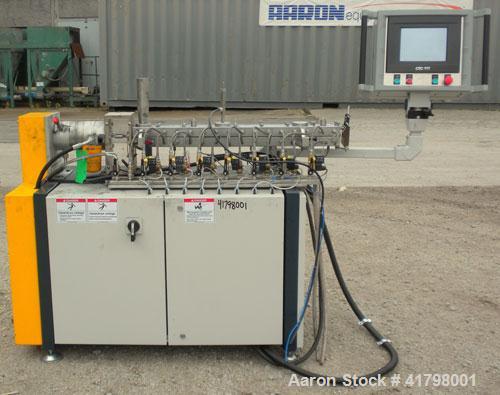 Used Farrel 26 MM Laboratory Twin Screw Extruder, Model FTX20. Co-Rotating inter-meshing side by side screw design, approximately 41’’ long. Nickel-Iron alloy clam shell design barrel, water cooled. ...