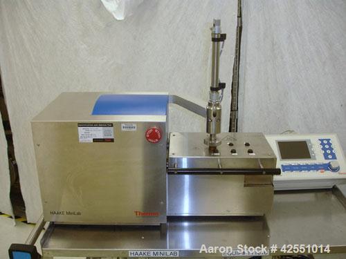 Used Haake Twin Screw Extruder, Model MINILAB. Co-rotating conical screws, electrically heated, water cooled barrel, with Thermo Fischer force feeder with minilab controller, serial #1200502065001.