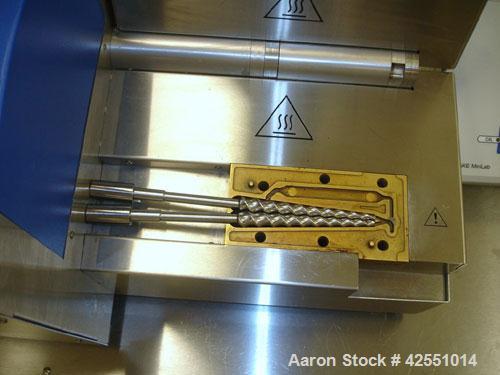 Used Haake Twin Screw Extruder, Model MINILAB. Co-rotating conical screws, electrically heated, water cooled barrel, with Thermo Fischer force feeder with minilab controller, serial #1200502065001.