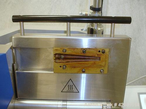 Used Haake Twin Screw Extruder, Model MINILAB. Co-rotating conical screws, electrically heated, water cooled barrel, with Thermo Fischer force feeder with minilab controller, serial #1200502065001.