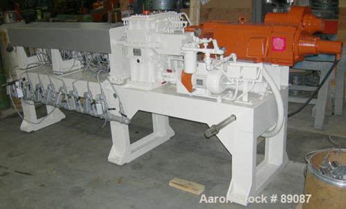 Used Maris 40 MM Twin Screw Extruder, Model TM40WW. Approximately 40:1 L/D ratio. Co-rotating screw design. 9 barrel sections measuring from the back of the feed barrel to end barrel is 62", (1) vent...