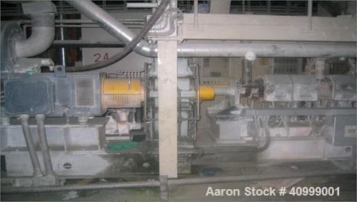 Used Maris Twin Screw Extrusion Line, Type TM70W/020391. 70mm, 36:1 L/D. Electrically heated, water cooled. Max screw speed 525 via a gearbox by a 180 kW-400 volt/50 cycle/3 ph main motor. Frame moun...