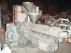 USED: NPC approximate 50mm twin screw extruder, model DMG50. Top vented barrel, electrically heated, water cooled, with tank, pump and heat exchanger. Water cooled feed throat with an approximate 1.5...