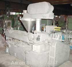 USED: NPC approximate 50mm twin screw extruder, model DMG50. Top vented barrel, electrically heated, water cooled, with tank, pump and heat exchanger. Water cooled feed throat with an approximate 1.5...