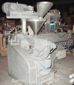 USED: NPC approximate 50mm twin screw extruder, model DMG50. Top vented barrel, electrically heated, water cooled, with tank, pump and heat exchanger. Water cooled feed throat with an approximate 1.5...