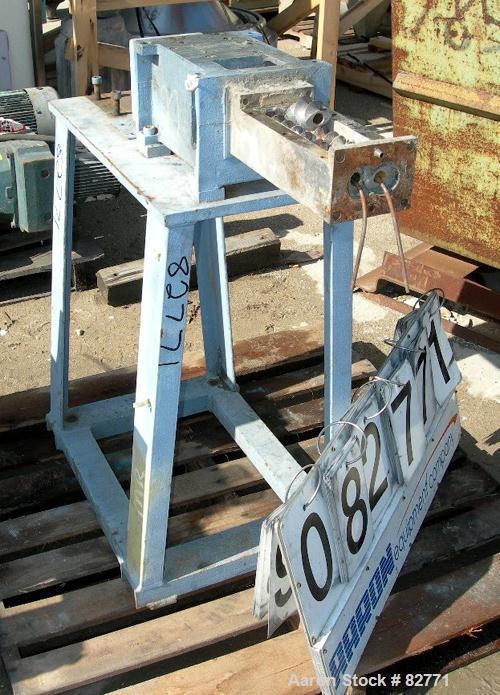 USED: Werner Pfleiderer twin screw side feeder, model ZSB-40. Unit requires 2 shafts and motor. Last used with a 58mm extruder. Mounted on a carbon steel stand. Built 1988.