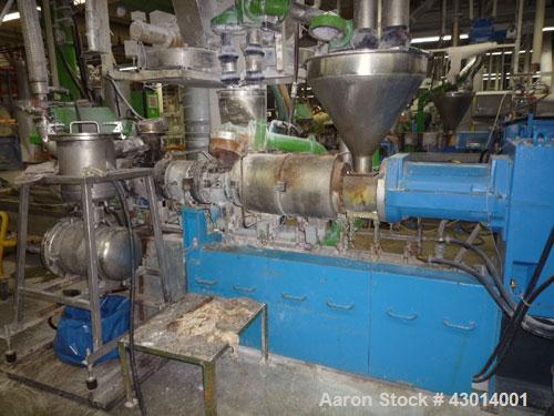 Used Berstoff Twin Screw Extruder, type ZE60A-33D, Co-rotating. Max screw speed 500 RPM via a Flender gearbox, ratio 5:1 by a 150KW/225HP-2500 RPM-380volt/50cycle/3Ph motor. incl. 2 x side feeder and...