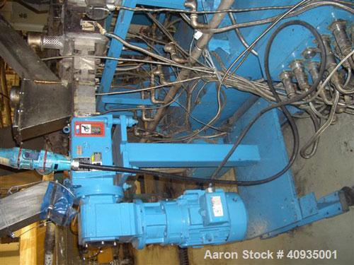 Used Twin Screw Extruder, 83 mm, 10 Barrels. Electrically heated and water cooled. 200 hp DC/SCR drive. Complete temp control panel. (1) ZSB 70 side feeder. Mfg 2004. Multi hole strand die.