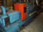 Used Twin Screw Extruder 90/92 mm. 12 barrel design. 4.997 gearbox ratio. 350 rpm output. 400 hp DC/SCR drive. Complete temp control panel. (2) ZSB 70mm side feeders. Multi hole strand die.