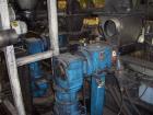 Used Twin Screw Extruder 90/92 mm. 12 barrel design. 4.997 gearbox ratio. 350 rpm output. 400 hp DC/SCR drive. Complete temp control panel. (2) ZSB 70mm side feeders. Multi hole strand die.