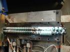 USED: APV 15MM lab size twin screw extruder, model MP2015. Co-rotating screw design. Electrically heated, water cooled barrel. Feed hopper with an accurate feeder. Driven by a 3/4 hp, 90 volt, 1725 r...