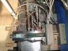 USED: APV 15MM lab size twin screw extruder, model MP2015. Co-rotating screw design. Electrically heated, water cooled barrel. Feed hopper with an accurate feeder. Driven by a 3/4 hp, 90 volt, 1725 r...