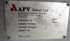 Used APV Baker Perkins 30mm Twin Screw Compounder Extruder, Model MP30. Approximate 15 to 1 L/D ratio. Co-rotating screw design. Clamshell design, 3 zone electrically heated, liquid cooled barrel. Wa...