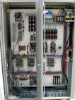 Used Baker Perkins Twin Screw Extruder, 50 MM Screw Diameter, Model MP2050. Approximate 25:1 L/D ratio. Co-rotating screw design. Clamshell design, 5 zone electrically heated, water cooled barrel sec...