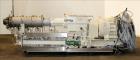Used Berstorff 75mm Twin Screw Extruder, Model ZE75A. 4 barrel Zone electrically heated, water cooled system including pump and heat exchanger. Approximate 2.95
