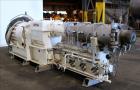 Used Berstorff 75mm Twin Screw Extruder, Model ZE75A. 4 barrel Zone electrically heated, water cooled system including pump and heat exchanger. Approximate 2.95