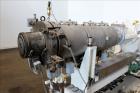 Used Berstorff 75mm Twin Screw Extruder, Model ZE75A. 4 barrel Zone electrically heated, water cooled system including pump and heat exchanger. Approximate 2.95
