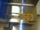 Used Haake Twin Screw Extruder, Model MINILAB. Co-rotating conical screws, electrically heated, water cooled barrel, with Thermo Fischer force feeder with minilab controller, serial #1200502065001.