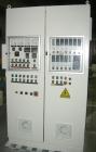 Used Maris 40 MM Twin Screw Extruder, Model TM40WW. Approximately 40:1 L/D ratio. Co-rotating screw design. 9 barrel sections measuring from the back of the feed barrel to end barrel is 62