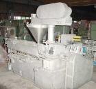 USED: NPC approximate 50mm twin screw extruder, model DMG50. Top vented barrel, electrically heated, water cooled, with tank, pump and heat exchanger. Water cooled feed throat with an approximate 1.5...