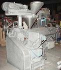 USED: NPC approximate 50mm twin screw extruder, model DMG50. Top vented barrel, electrically heated, water cooled, with tank, pump and heat exchanger. Water cooled feed throat with an approximate 1.5...