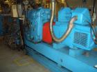Used Twin Screw Extruder, 83 mm, 10 Barrels. Electrically heated and water cooled. 200 hp DC/SCR drive. Complete temp control panel. (1) ZSB 70 side feeder. Mfg 2004. Multi hole strand die.