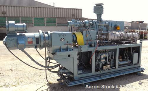 Used American Maplan Approximate 62mm Counter-Rotating Twin Screw Extruder, Model DSK62. (2) 2.44" Diameter x 48" long intermeshing tapered screws. Electrically heated, water cooled 4 zone vented bar...